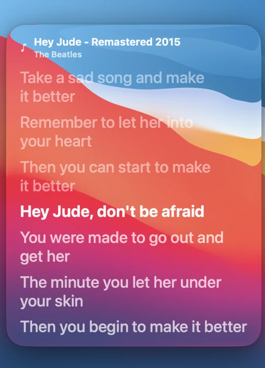 The Live Lyrics widget highlighting the current line of a song on a Mac lock screen